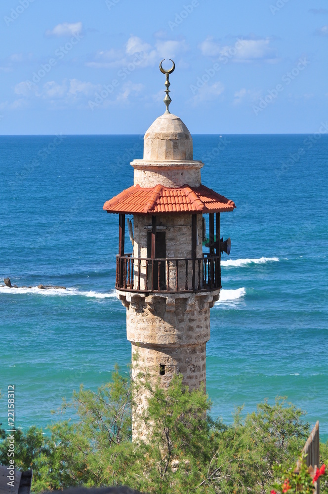 The minaret of Jaffa mosque with the view to mediterranean sea. Israel. The minaret of Jaffa mosque with the view to mediterranean sea. Israel.