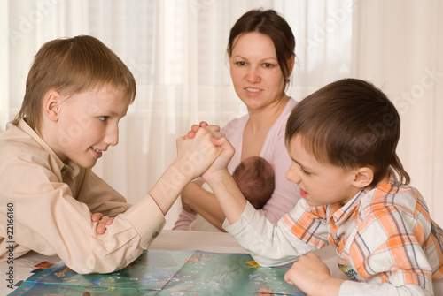 mother with sons and a newborn resting