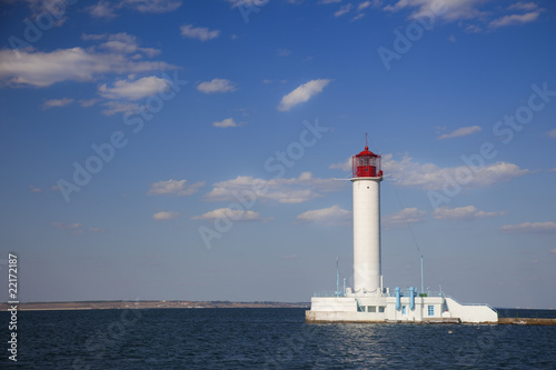 white lighthouse against the blue sky