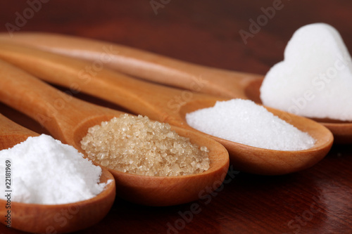 Sugar in wooden spoons
