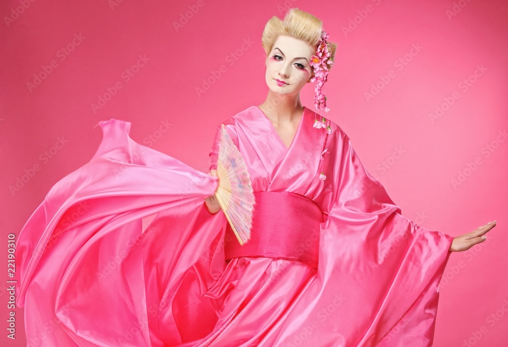 Fototapeta premium Beautiful geisha dancing with a fan