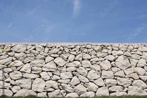 Wall background with grass and sky
