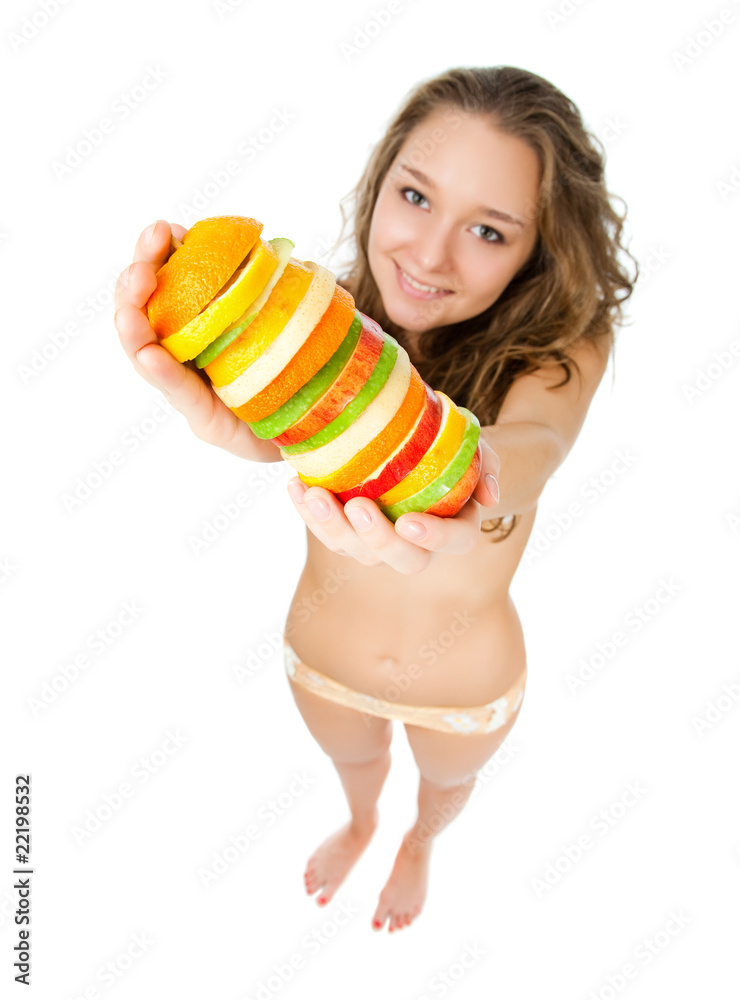 Obraz premium Portrait of happy young woman holding mixed fruits