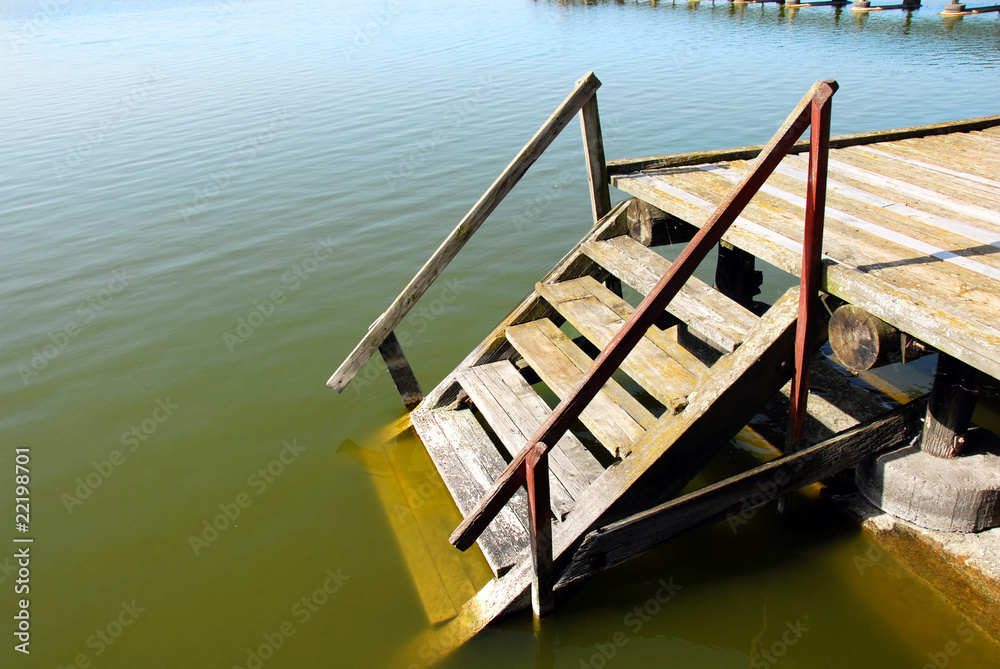 Wooden stairs into water