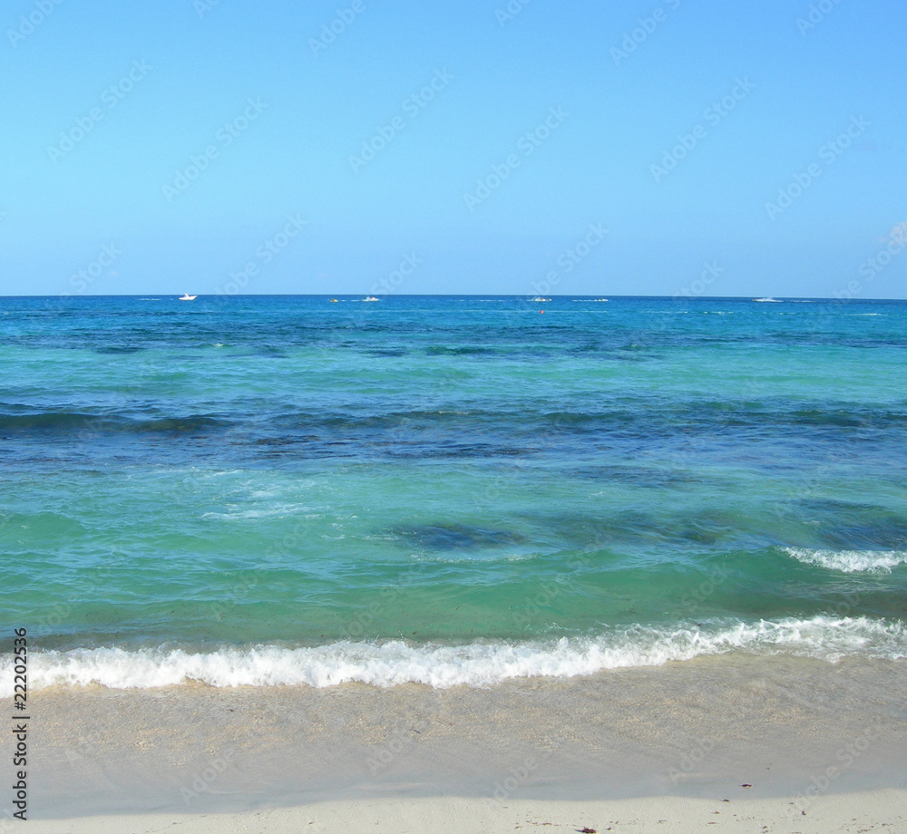Caribbean beach with waves at the Atlantic in Cancun, Mexico