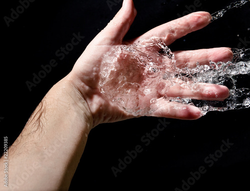 Hand and splashing water © Kushch Dmitry
