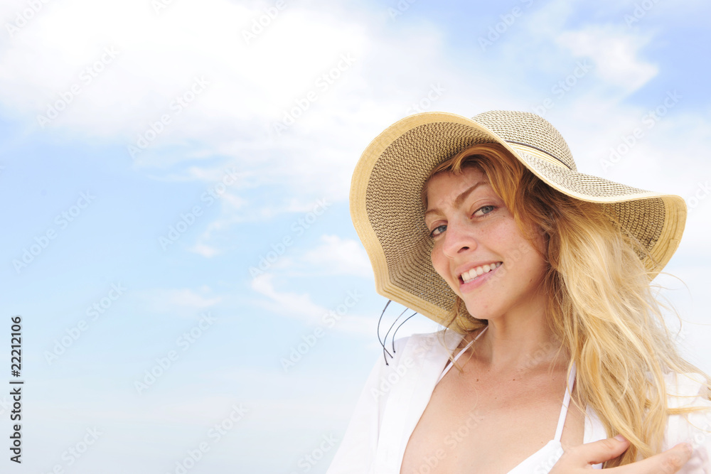 summer: woman with straw hat  and copy space
