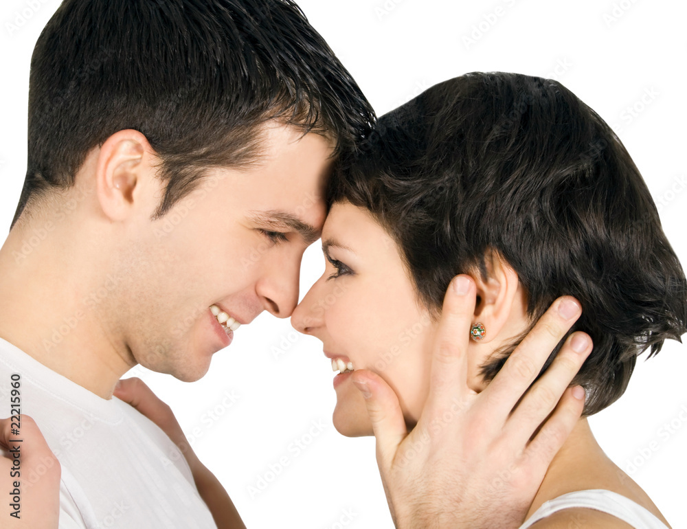 Profile of a smiling young couple in love Profile of a smiling young couple in love