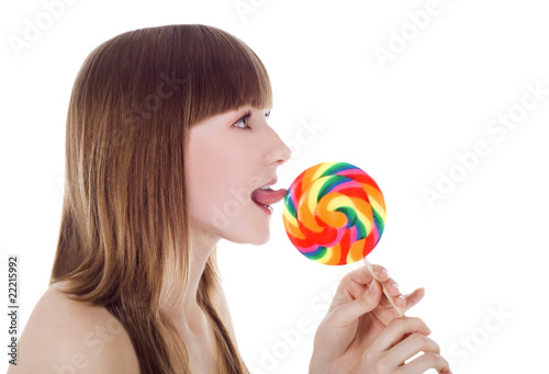Bright picture of happy blonde with color lollipop © Aleksandr Kurganov
