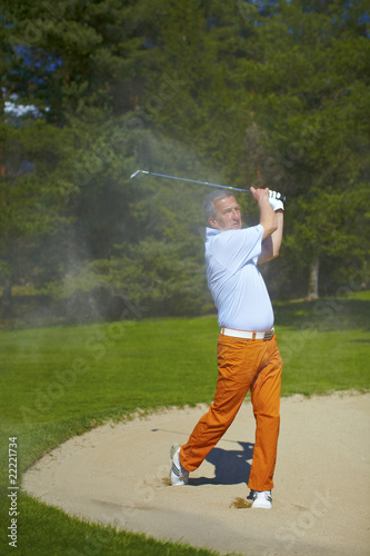 Man at the bunker on a golf course