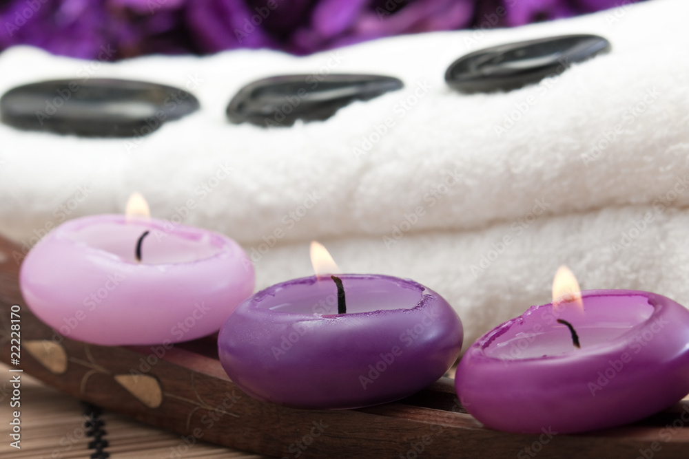 hotstones on towel with purple candles (2) hotstones on towel with purple candles (2)