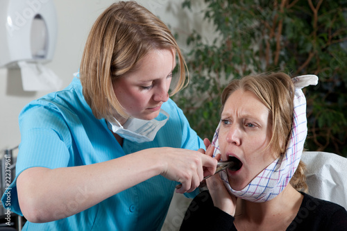 Pulling a tooth photo