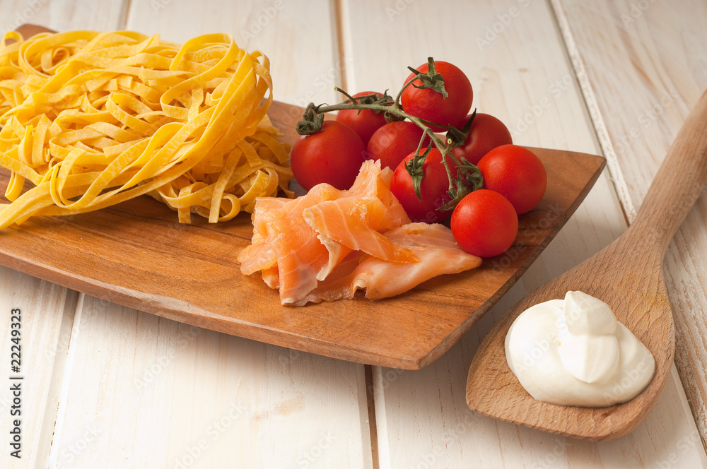 cutting board with ingredients for salmon pasta cutting board with ingredients for salmon pasta