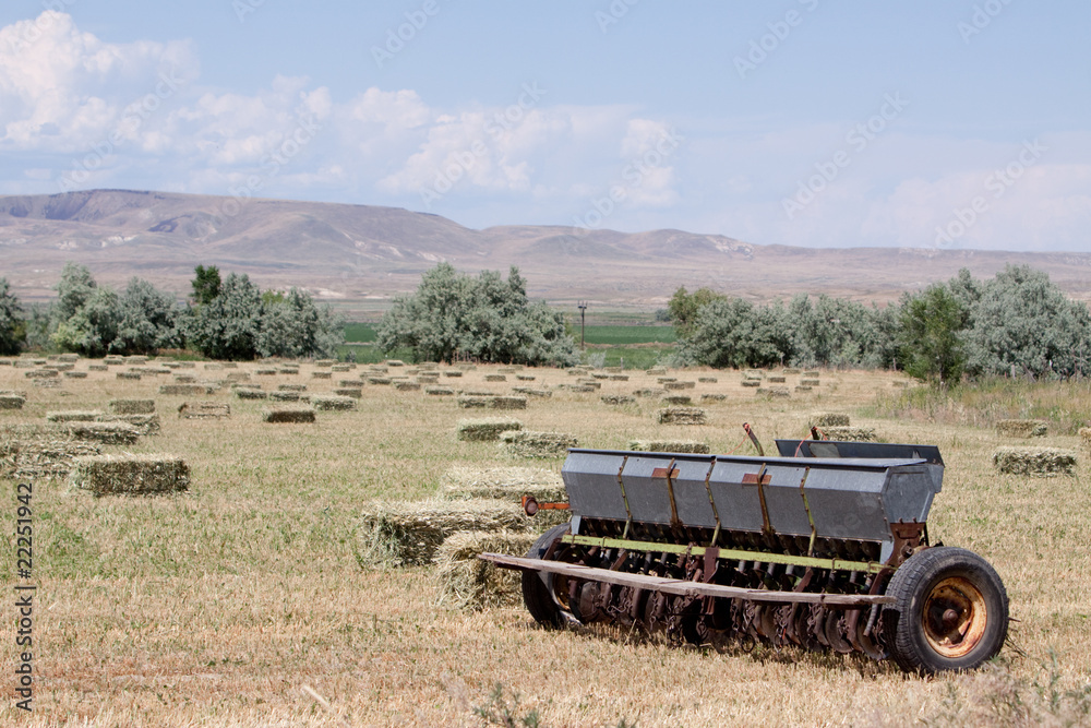 Fototapeta premium Haystacks and baler