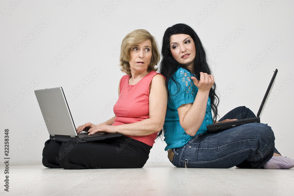 Women conversation and using laptops