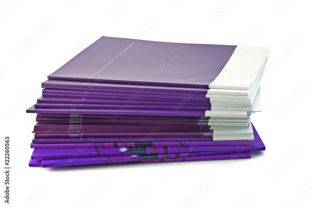 Pile of color magazines isolated on white background Pile of color magazines isolated on white background