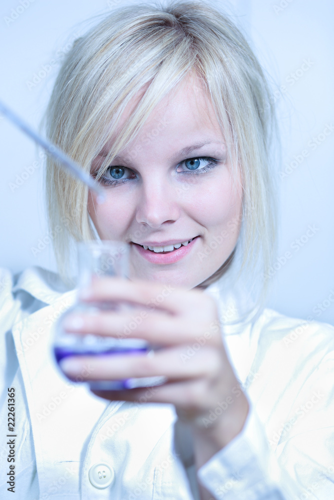 Closeup of a female researcher carrying out experiments in a lab Closeup of a female researcher carrying out experiments in a lab