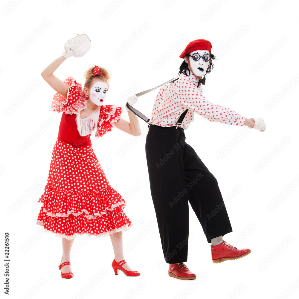 portrait of mimes. angry woman beating man portrait of mimes. angry woman beating man