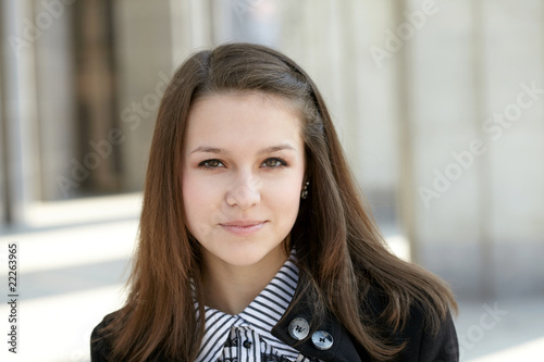 beautiful young girl near library