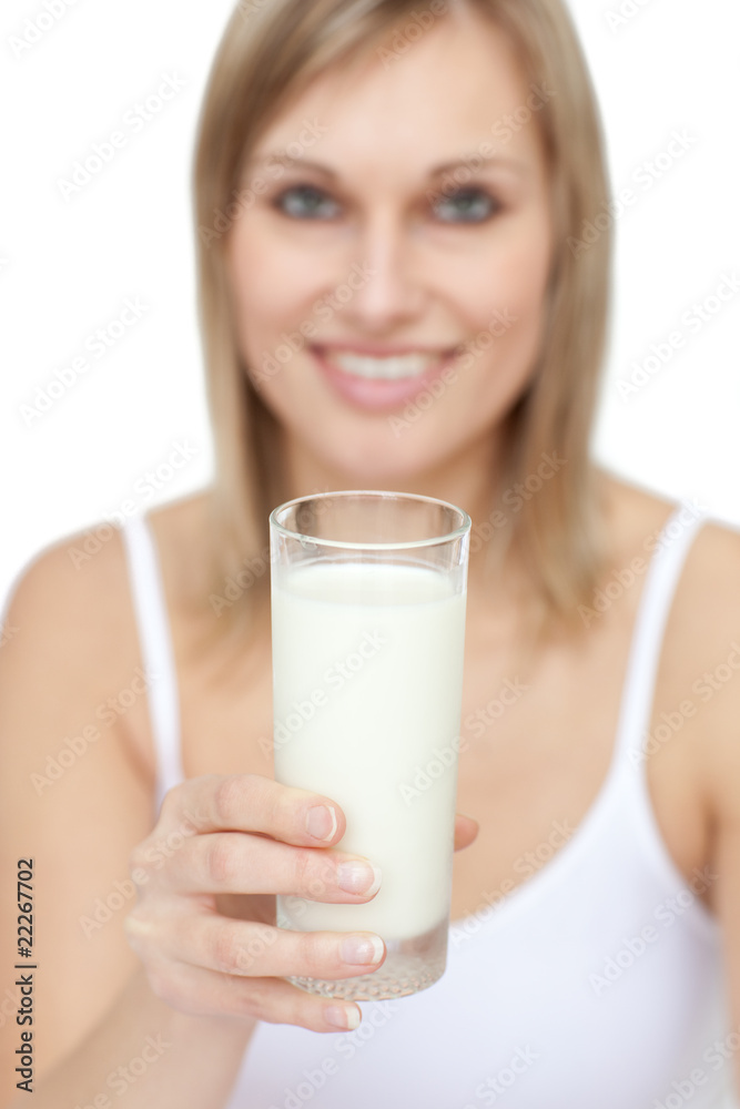 Blond woman holding a glass of milk