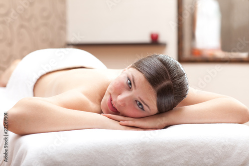 Woman ready for massage in a spa setting