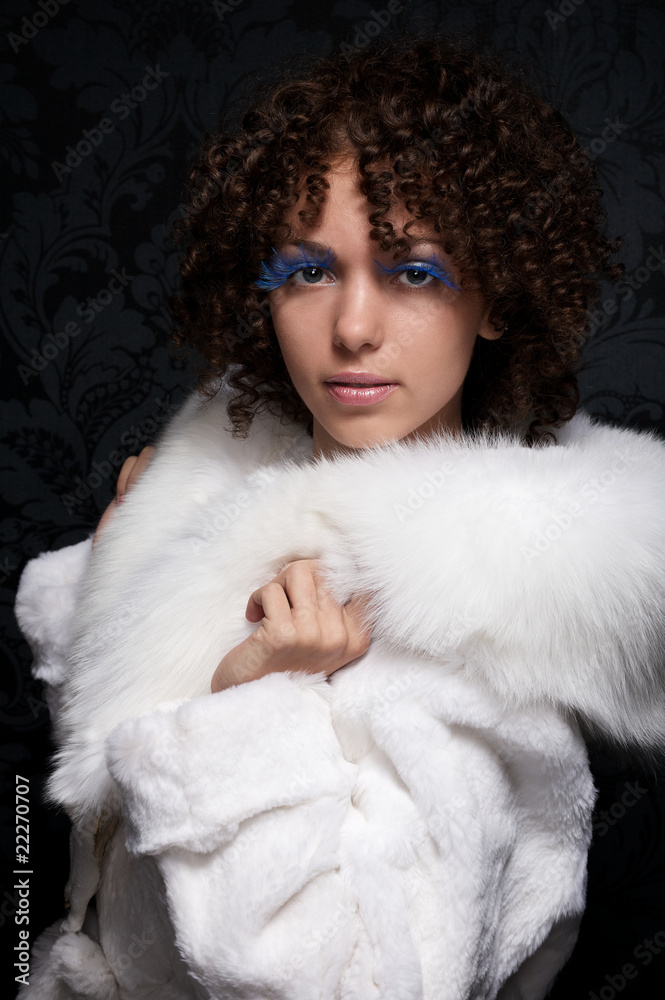 Portrait of a beautiful curly woman in furs Portrait of a beautiful curly woman in furs