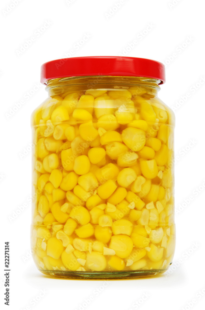 Sweet corn in glass jar isolated on white Sweet corn in glass jar isolated on white
