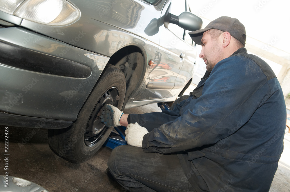machanic repairman at tyre replacement