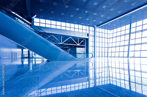 Escatator in blue hall