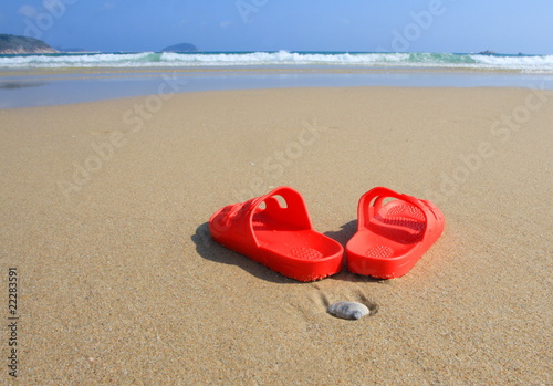 Red Beach slippers on seacoast