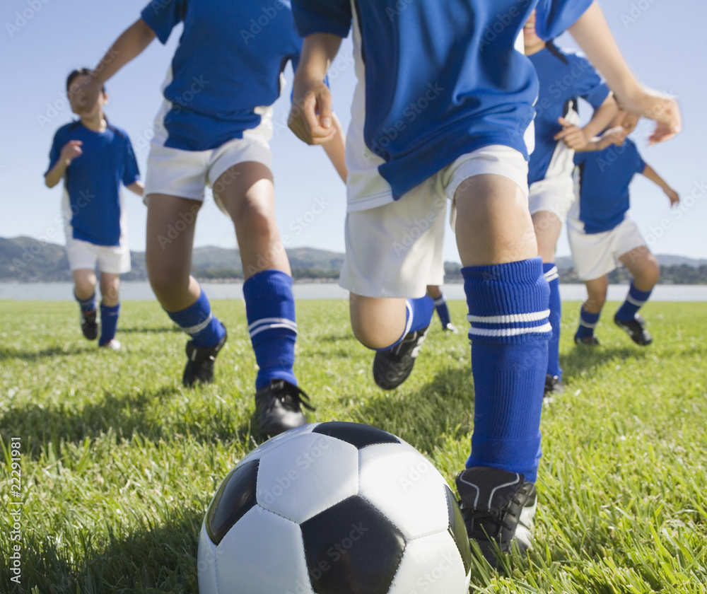 Asian children playing soccer