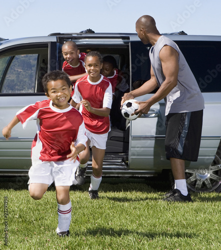 Multi-ethnic children in soccer uniforms photo