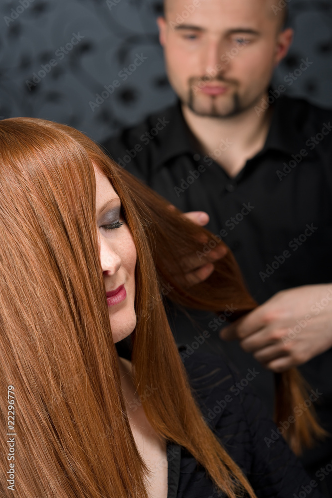 Fototapeta premium Professional hairdresser with fashion model at luxury salon