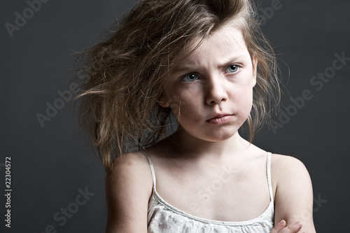 Messy Child against a Grey Background