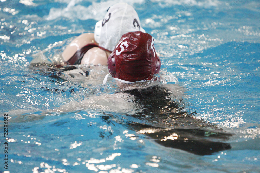 Female water polo players during a game.