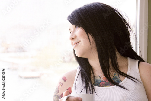 Woman by the Window with a Cup of Coffee
