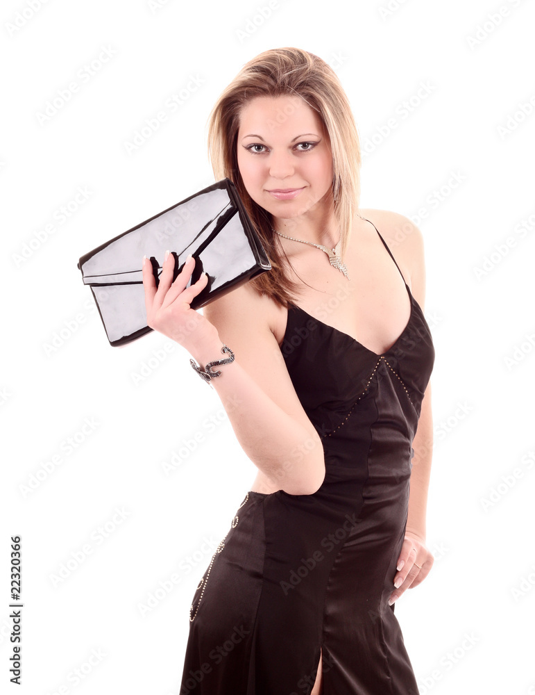 Beautiful woman posing in black dress with bag isolated on white Beautiful woman posing in black dress with bag isolated on white