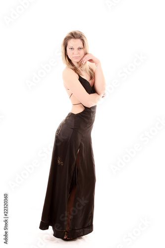Beautiful woman posing in black dress isolated on white
