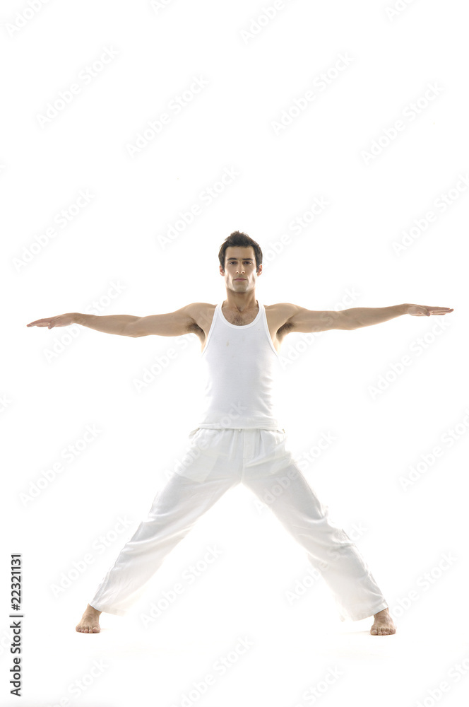 young male in white clothes is jumping with hands up young male in white clothes is jumping with hands up