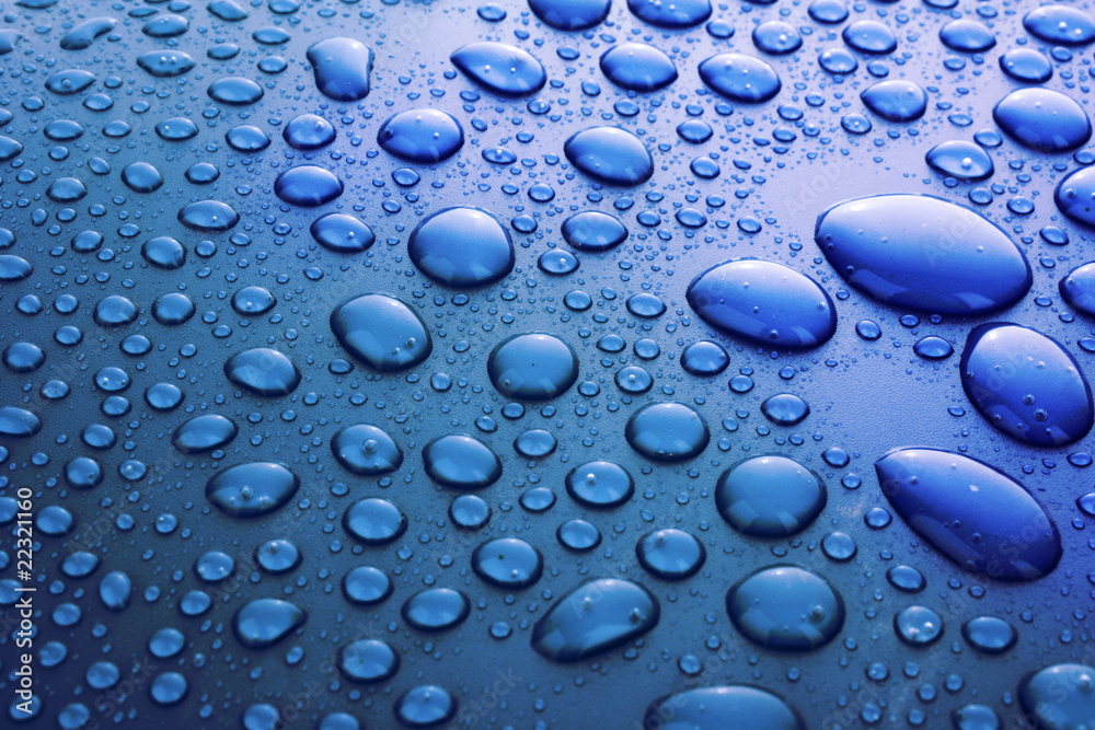 Blue water drops background with big and small drops Blue water drops background with big and small drops