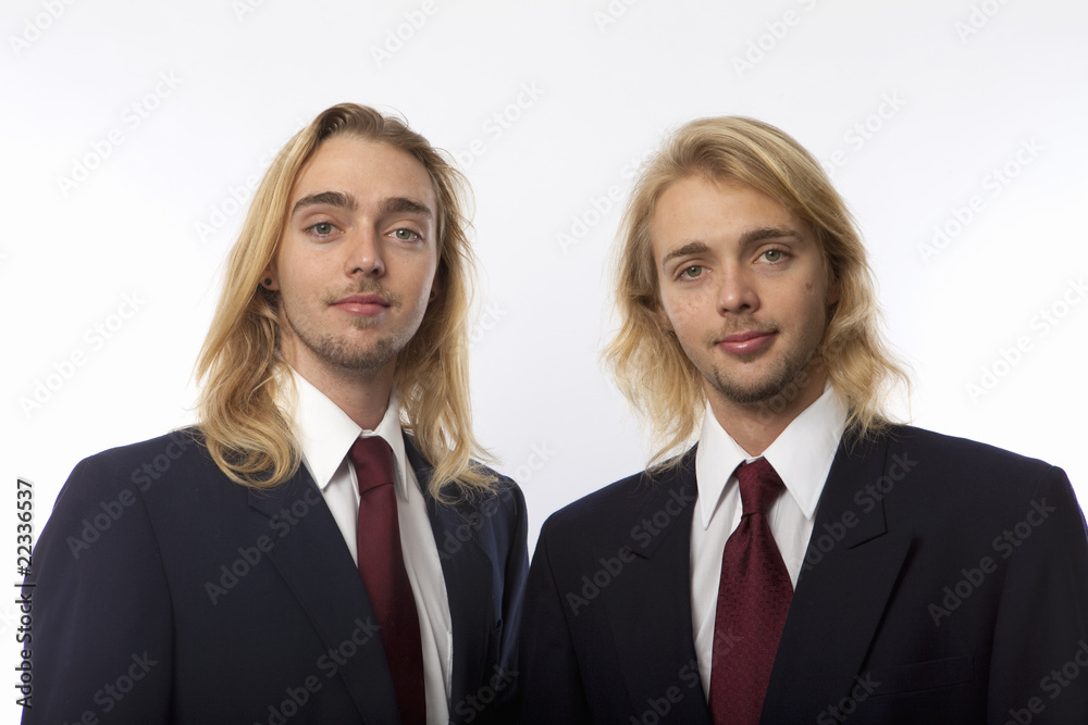 portrait of twin brothers in coat and tie portrait of twin brothers in coat and tie