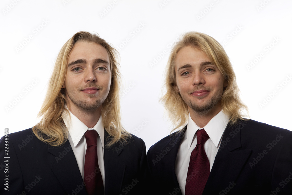 portrait of twin brothers in coat and tie