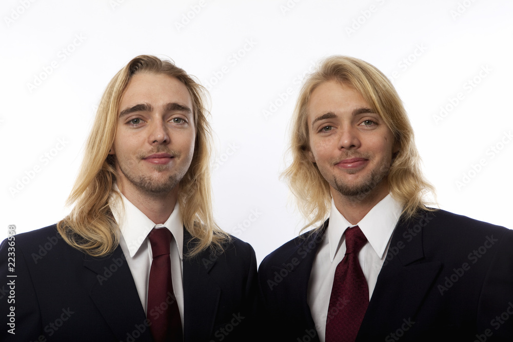 portrait of twin brothers in coat and tie portrait of twin brothers in coat and tie