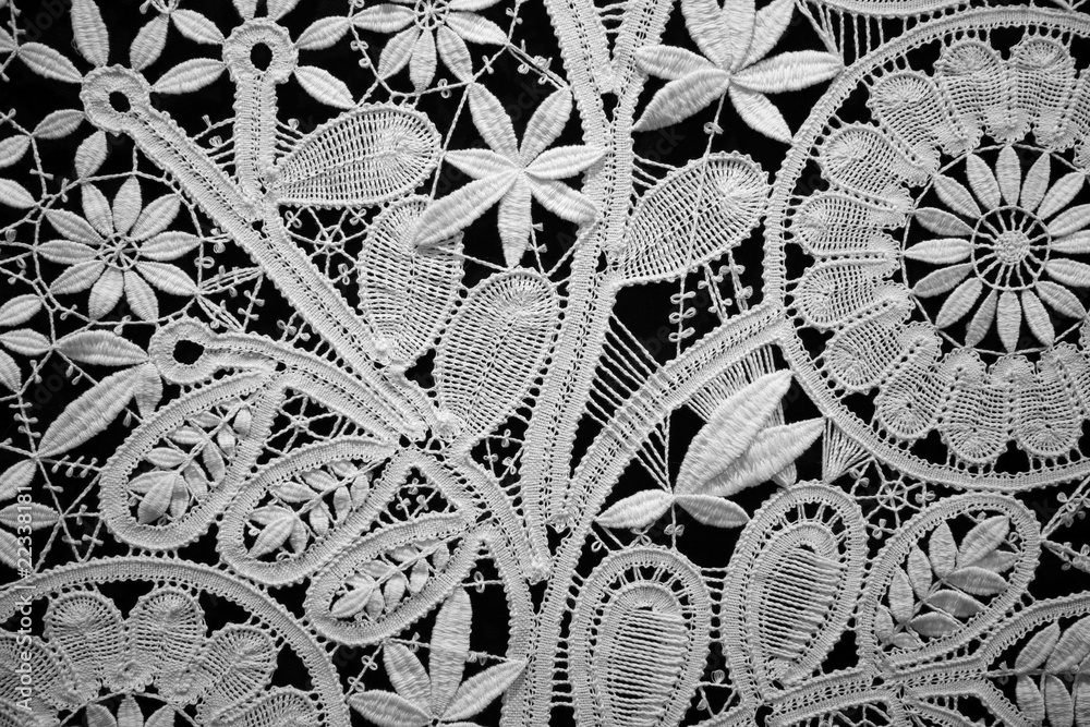 Lace doily on black background, close up. Horizontal format. - obrazy, fototapety, plakaty 