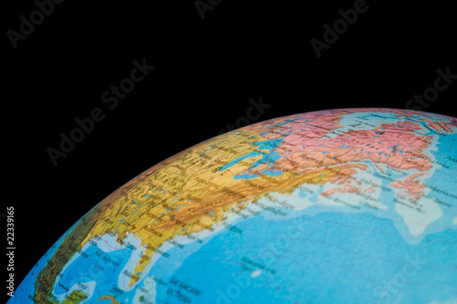 Fragment of  globe of world isolated on black background