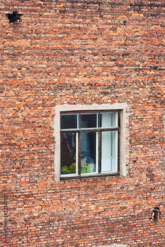 Brick wall with window.