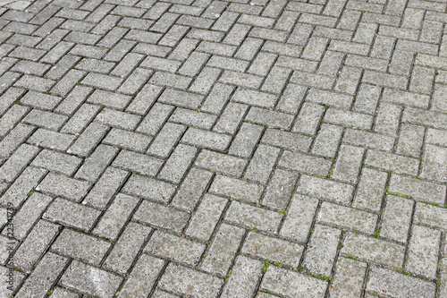 Gray paving cobblestone blocks pattern background.