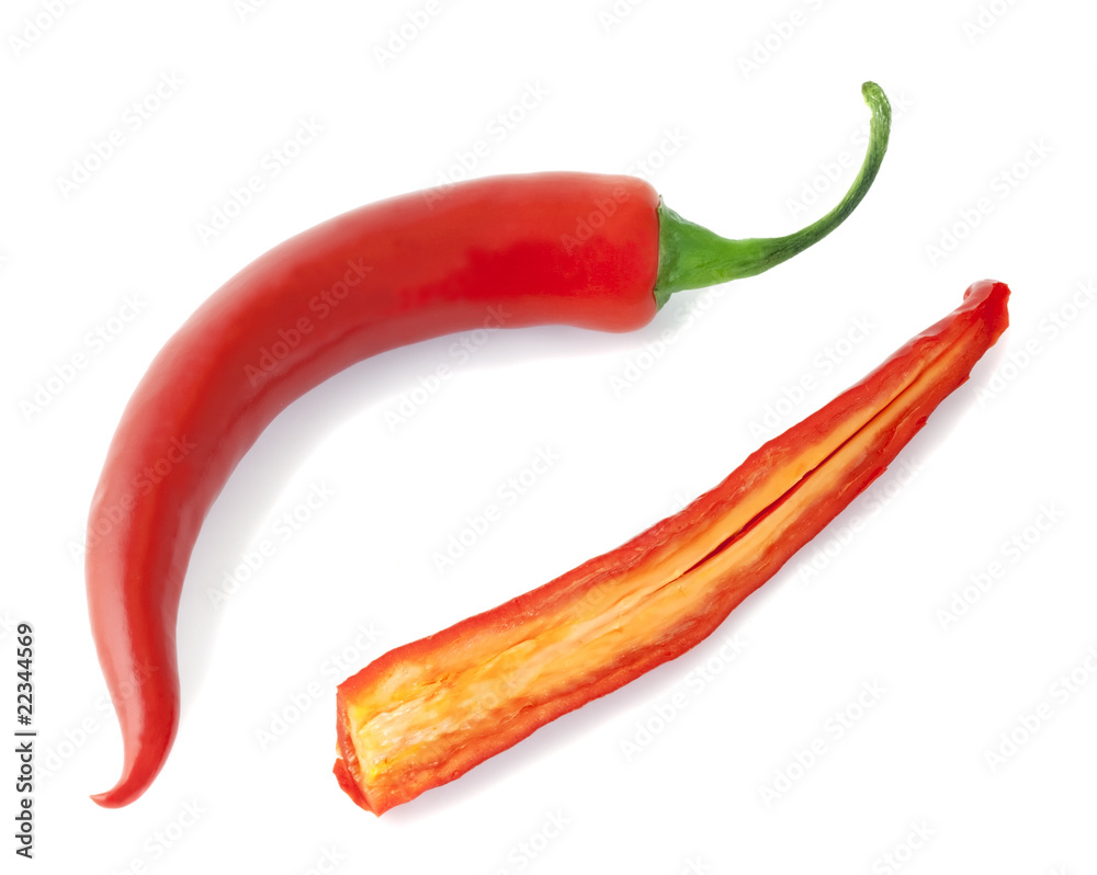 Red peppers isolated on white background. One halved. Red peppers isolated on white background. One halved.