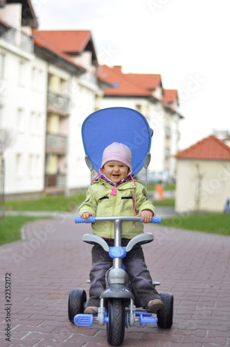 baby on blue bike
