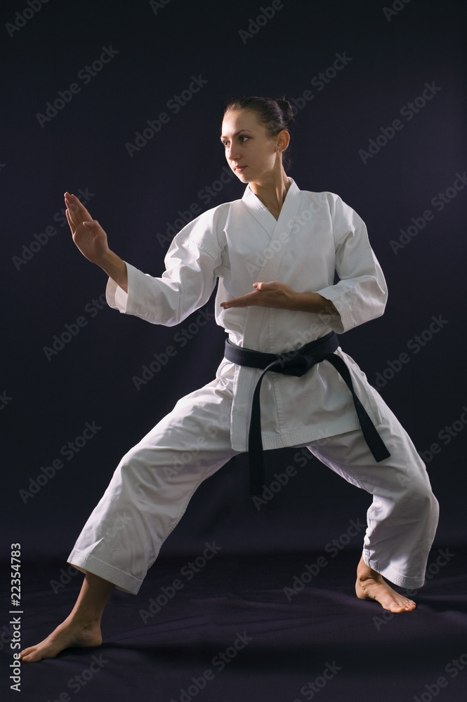 karateka girl on black background studio shot karateka girl on black background studio shot